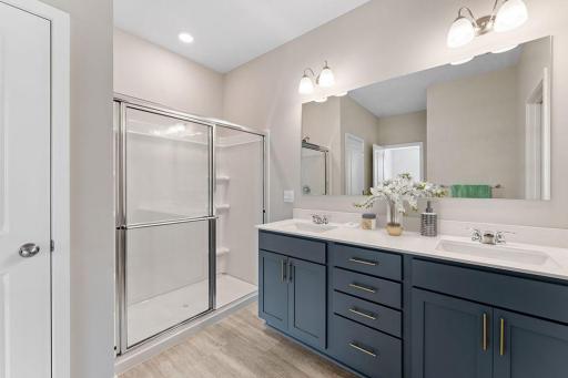 Fantastic primary ensuite with double bowl vanity, quartz countertops and a large walk-in closet. *Pictures are of model home; actual finishes may vary.