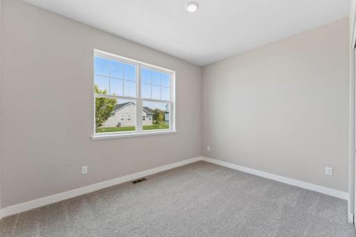 Front bedroom of the home is flooded with natural lighting! *Pictures are of model home; actual finishes may vary.