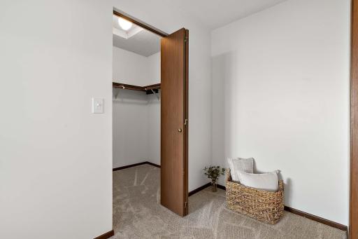 Spacious walk in closet in the primary bedroom