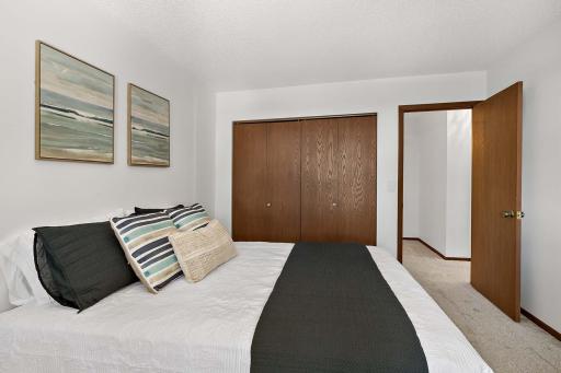 1 of 2 generously sized bedrooms on the upper level, offering comfort and ample space.