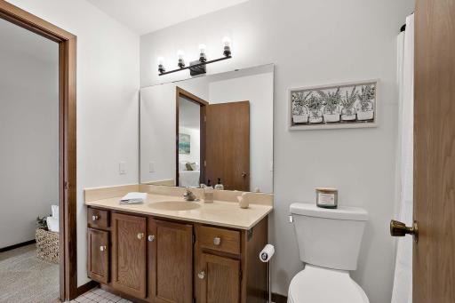 Bathroom with a walk-through layout, conveniently accessible from the main floor and upper-level bedrooms.
