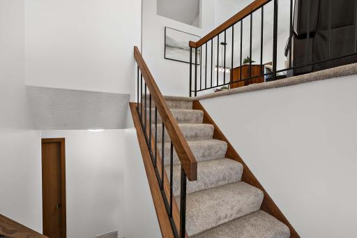 Bright entryway filled with natural light and highlighted by vaulted ceilings, creating an open and welcoming first impression.