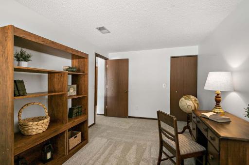 Lower-level bedroom, versatile for use as a guest room or home office.