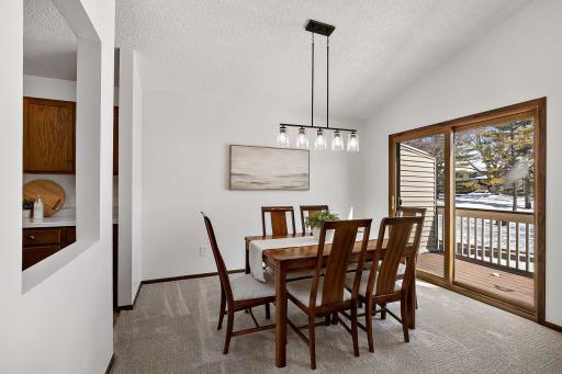 Dining room just off the kitchen for added convenience, with a sliding door to the deckâideal for entertaining.