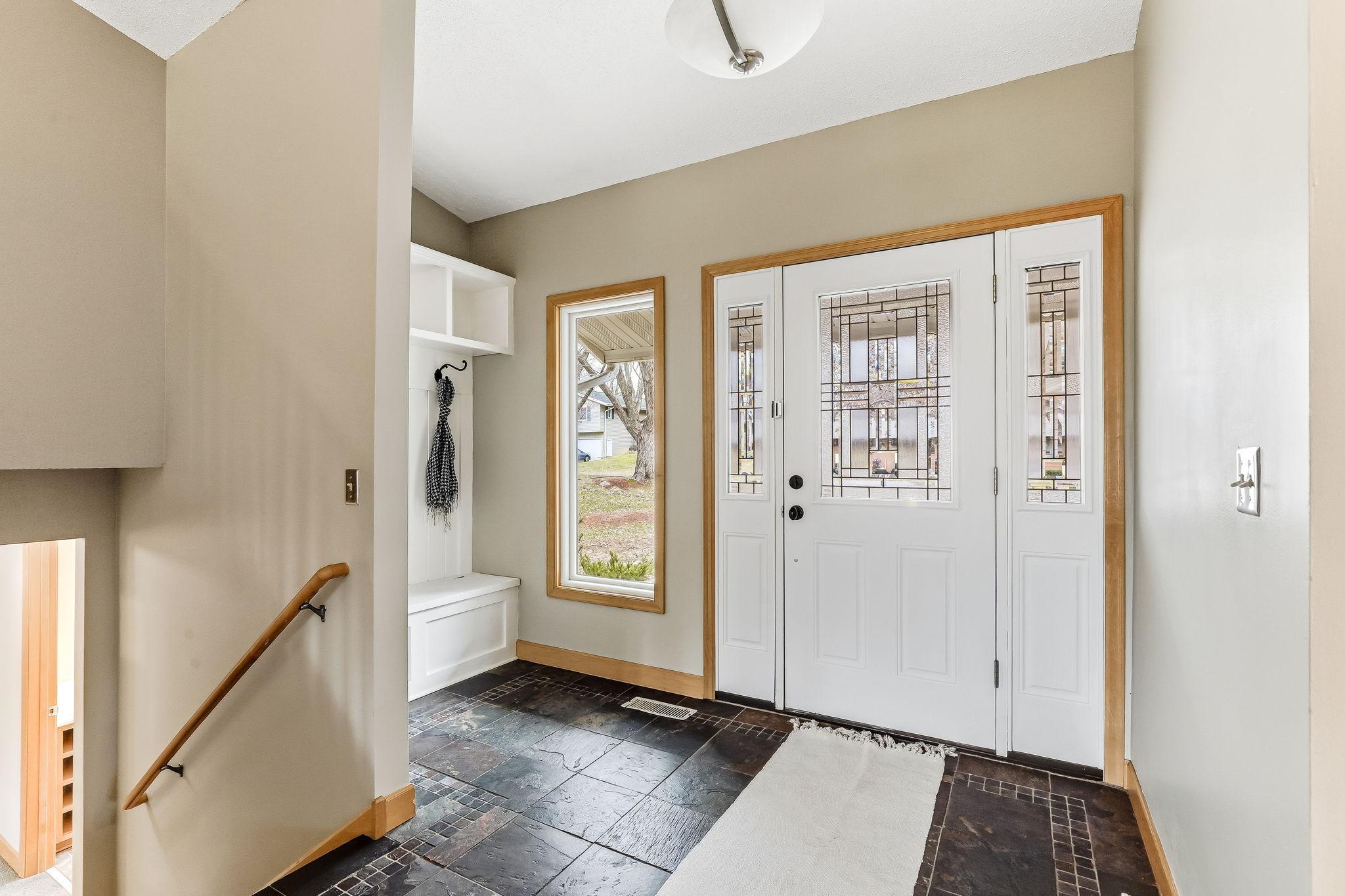 Spacious Foyer with Bench Seating