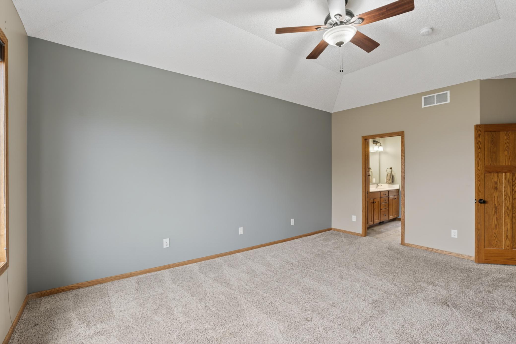 Primary bedroom looking into the bathroom/closet area