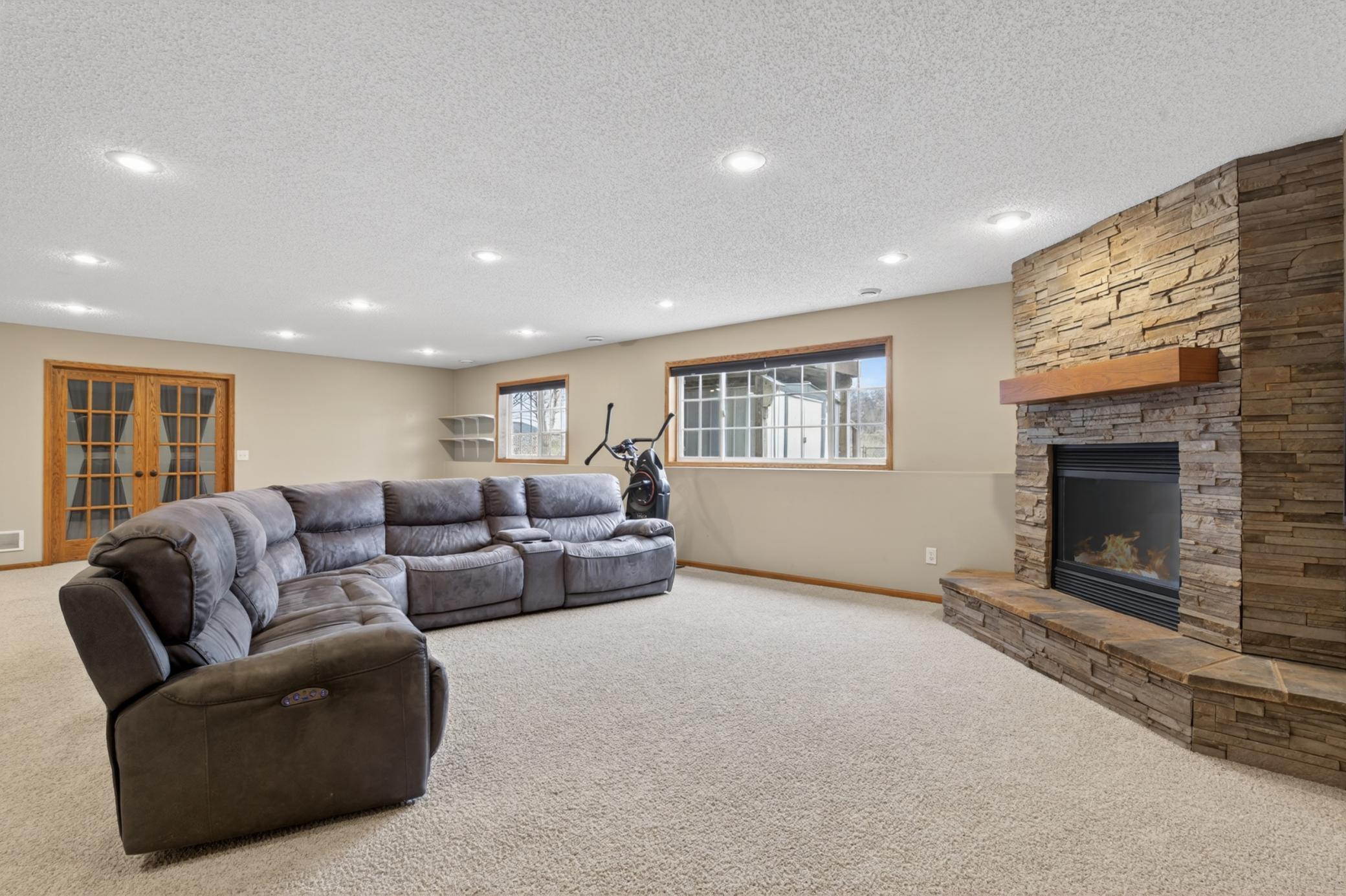 Lower level family room with gas fireplace