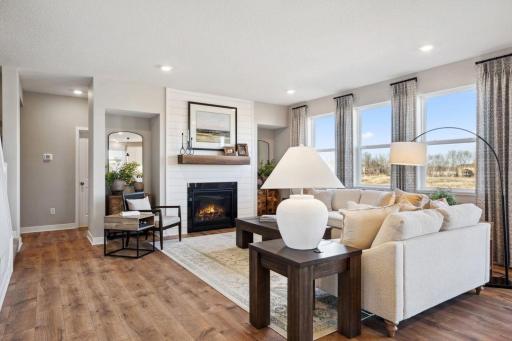 Big windows, beautiful built-ins, cozy fireplace - you won't want to leave your new home! Model photo, options and colors may vary.