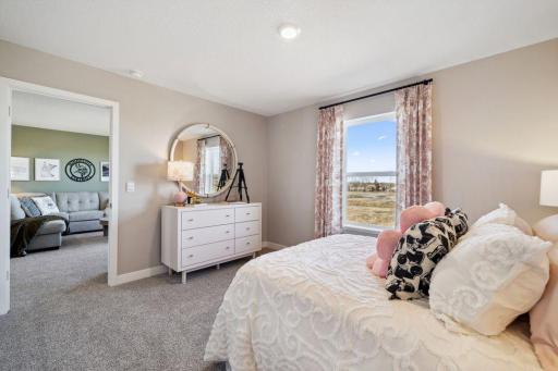Each of the additional 3 upstairs bedrooms boast their own walk-in closets! Model photo, options and colors may vary.