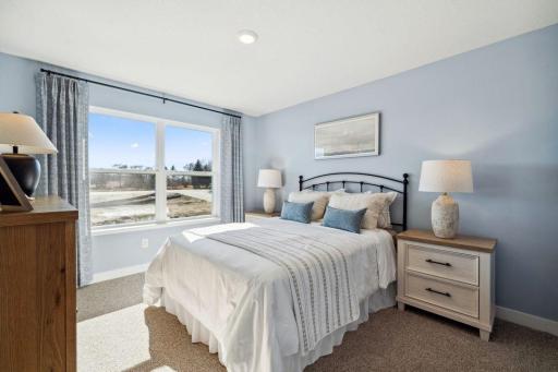 Each of the additional 3 upstairs bedrooms boast their own walk-in closets! Model photo, options and colors may vary.