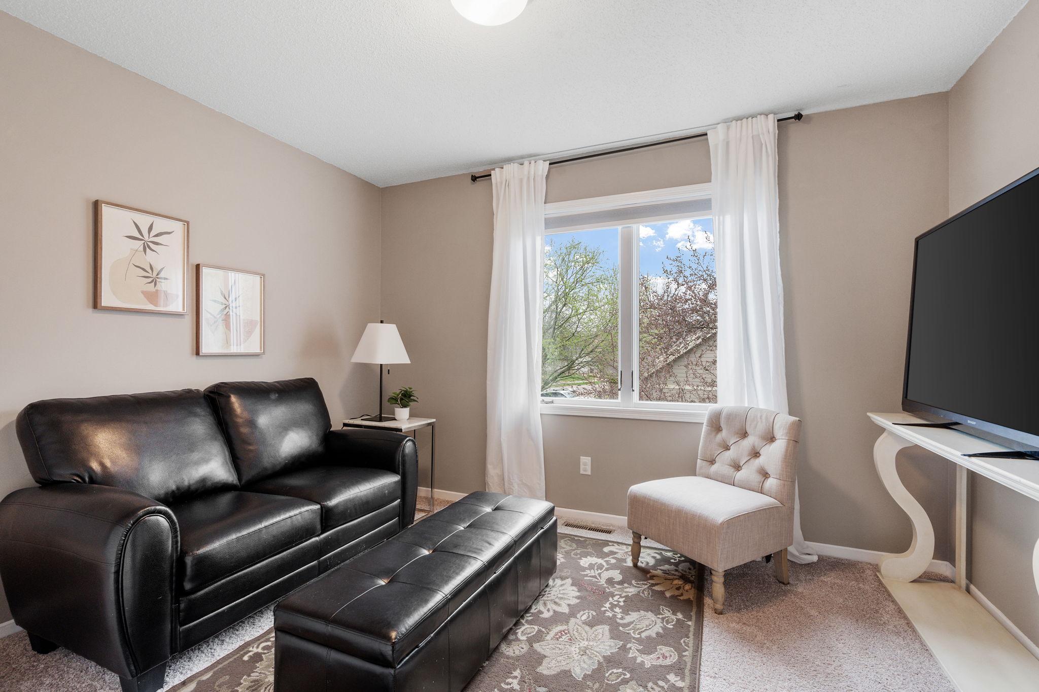 Upper level bedroom currently being used as sitting room