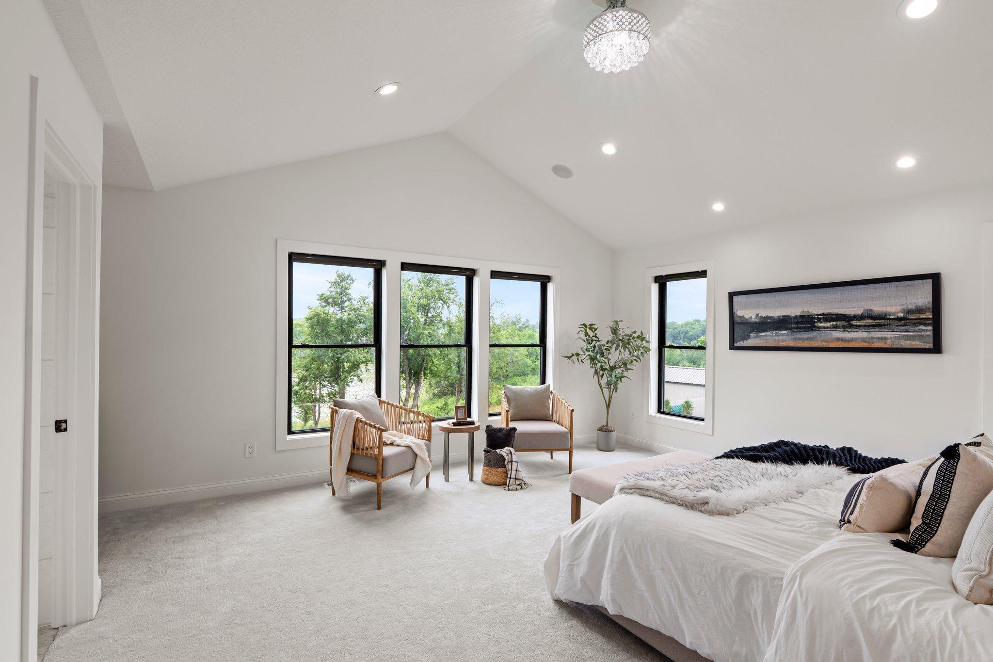 The upper level of this home is designed for comfort and features four spacious bedrooms that cater to every need.