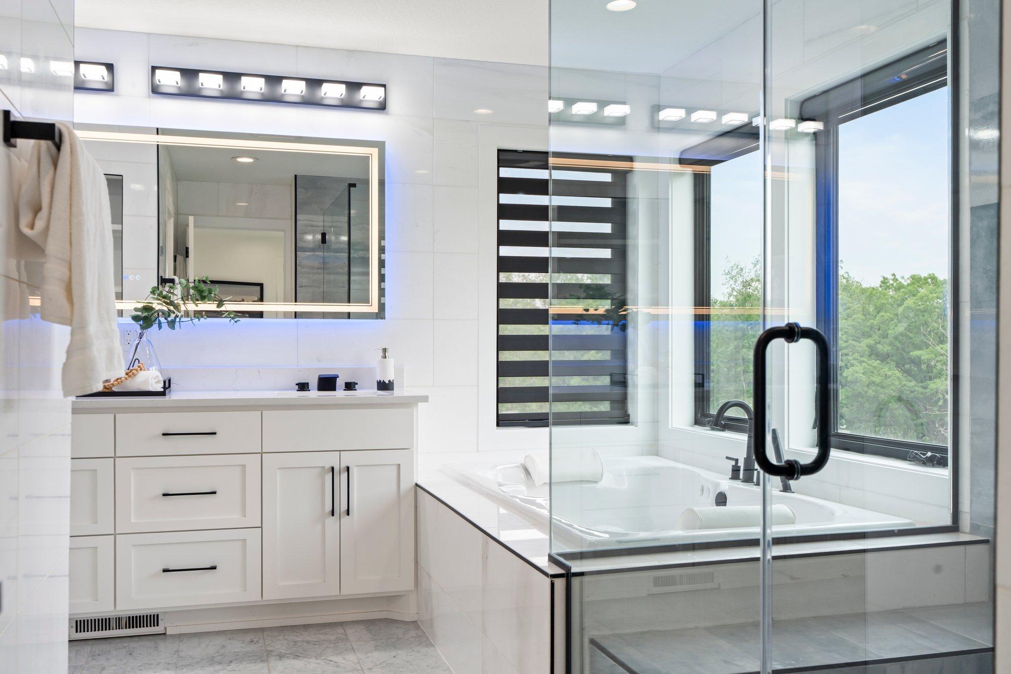 The en-suite bathroom is a true highlight, featuring a dual sink vanity and a private commode for added privacy.