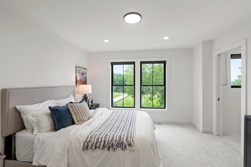 Offering extra privacy, this bedroom includes its own Â¾ bathroom with contemporary fixtures and a walk-in closet, making it perfect for guests.