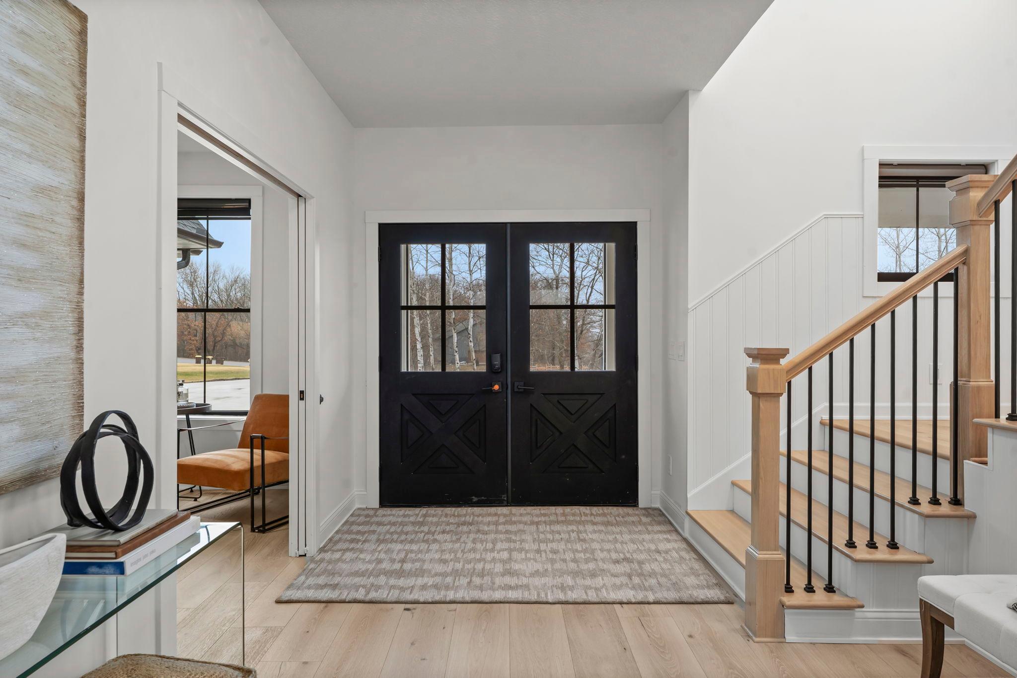 New white oak engineered hardwood floors flow throughout, setting the tone for refined rustic elegance.