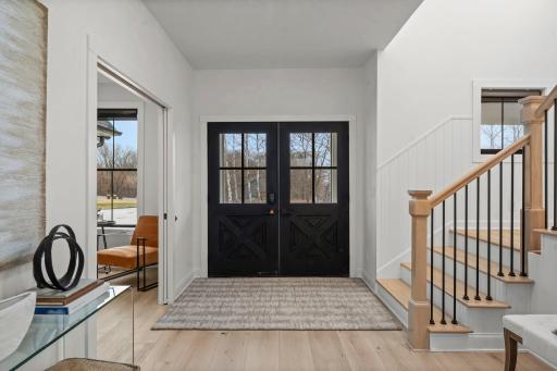 New white oak engineered hardwood floors flow throughout, setting the tone for refined rustic elegance.