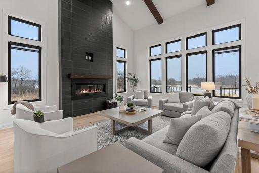 Upon entering, youâll be welcomed into the stunning great room where 18-foot vaulted ceilings create an impressive sense of space, beautifully accented by wood beams that add warmth and architectural charm.
