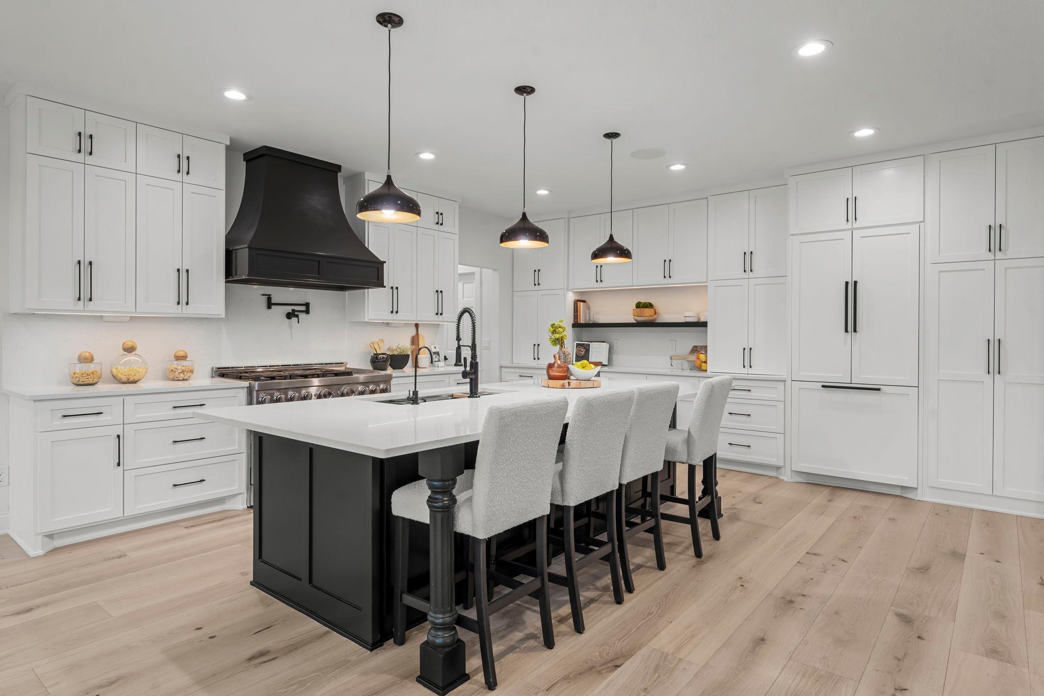 Step into luxury in this gourmet kitchen, where high-end appliances and thoughtful design combine to create a dream workspace.