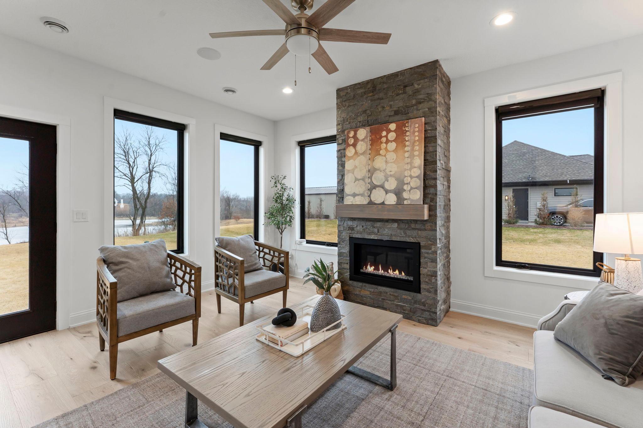 This four season porch is a delightful retreat that seamlessly blends comfort and elegance, making it the perfect space to enjoy the outdoors year-round.