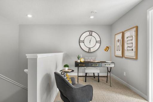 Convenient upper level loft space - perfect for a TV, game area, or working from home. Model photo. Options and colors may vary.