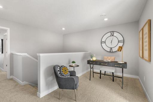 Convenient upper level loft space - perfect for a TV, game area, or working from home. Model photo. Options and colors may vary.