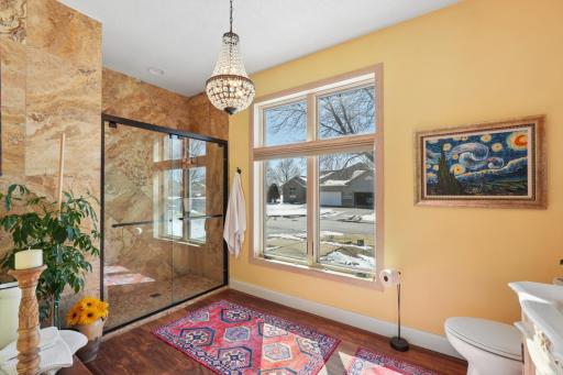 Floor-to-ceiling travertine tile shower!