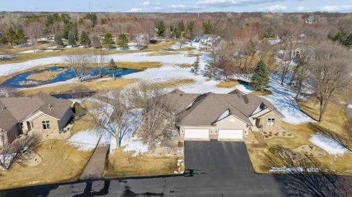 Rarely available townhome in the highly desirable Rum River Hills golf course community!