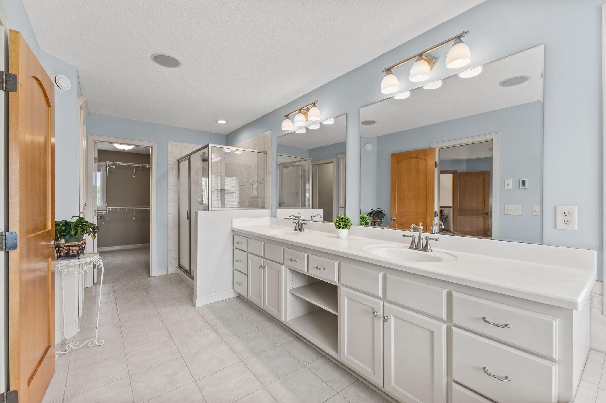 The private spa like primary bathroom with abundance of space and access to the huge walk in closet!