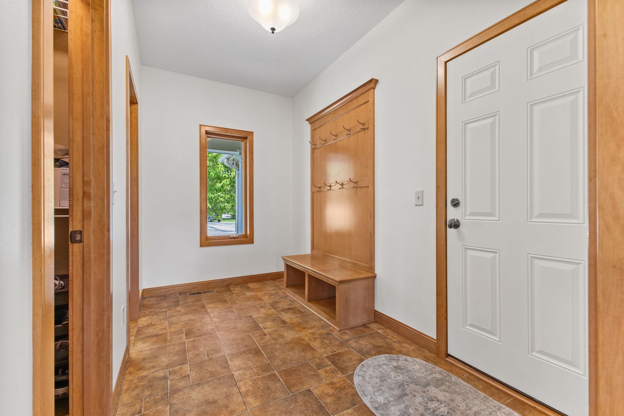 SPACIOUS entrance from the garage provides a space for the entire family. Plus, the large walk in closet delivers additional organization opportunities.