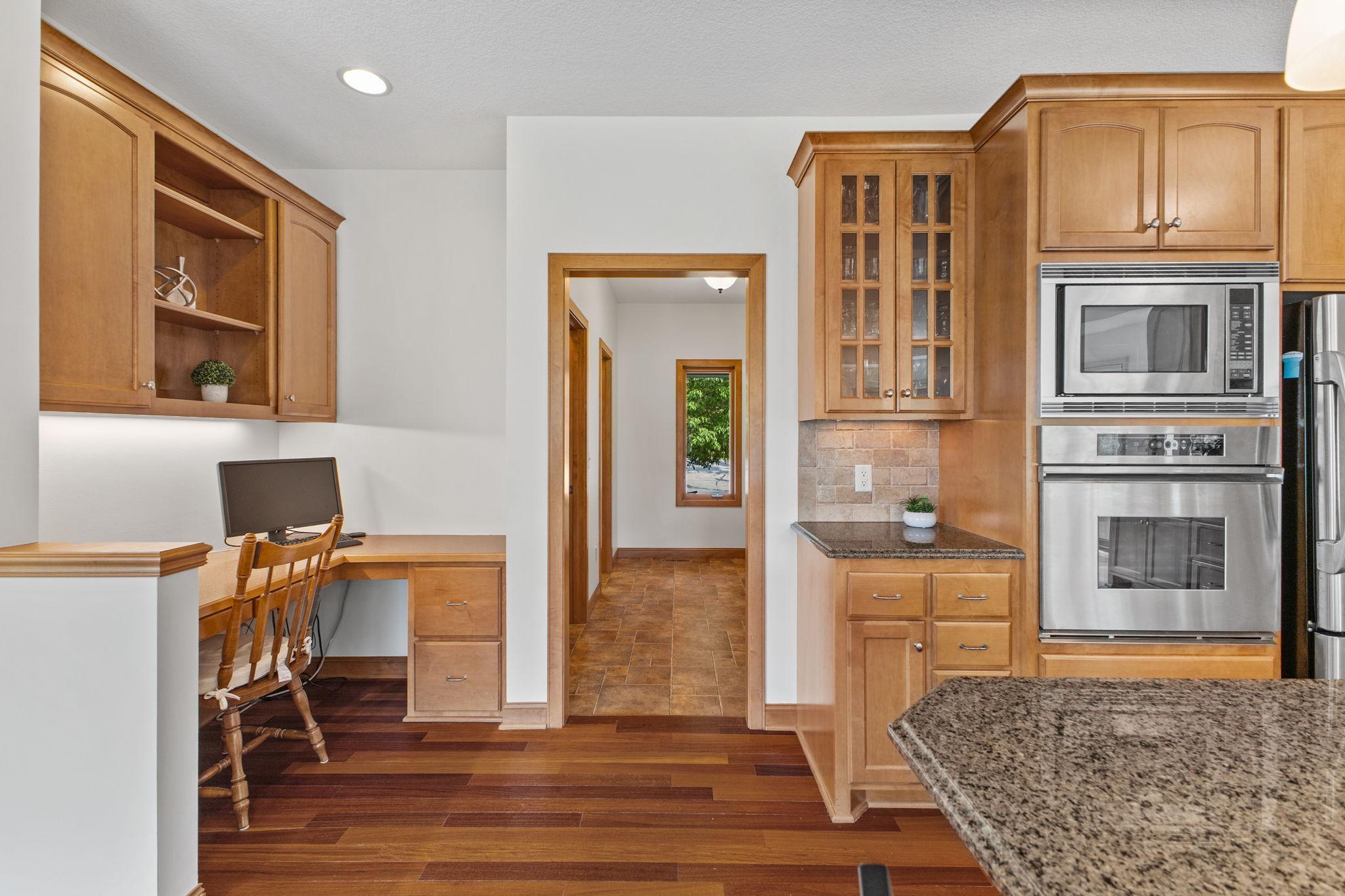 Keep your life & family organized with the built in desk that is tucked away yet accessible. Glass fronts on cabinets allow display of your favorite pieces.