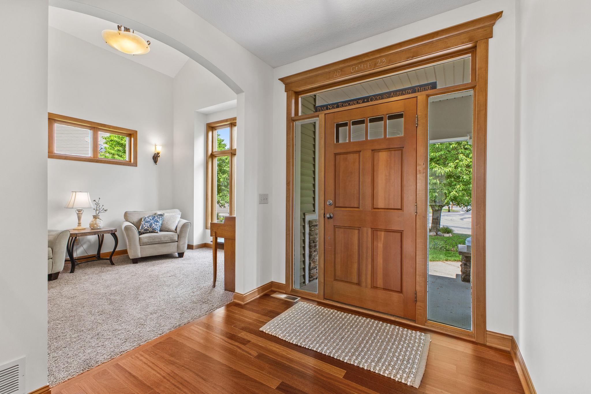 A warm welcome and your first peek at the premium finishes that this home showcases. Enjoy the sun filled rooms with transom windows placed strategically throughout.