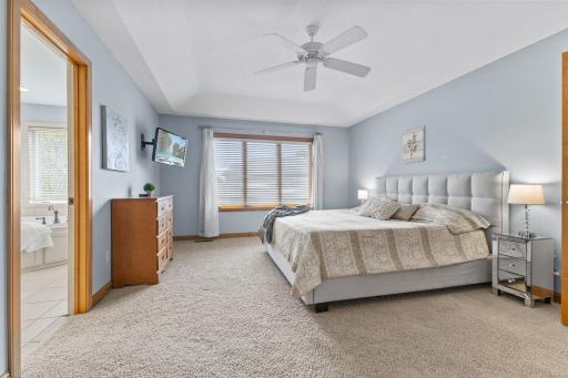 Primary ensuite! Custom window treatments, ceiling fan & neutral carpeting.