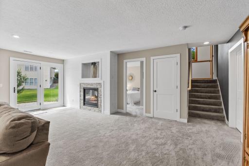 The lower level was recently finished in 2021 to add a fourth bedroom, dual sided fireplace and a huge recreation/living area.