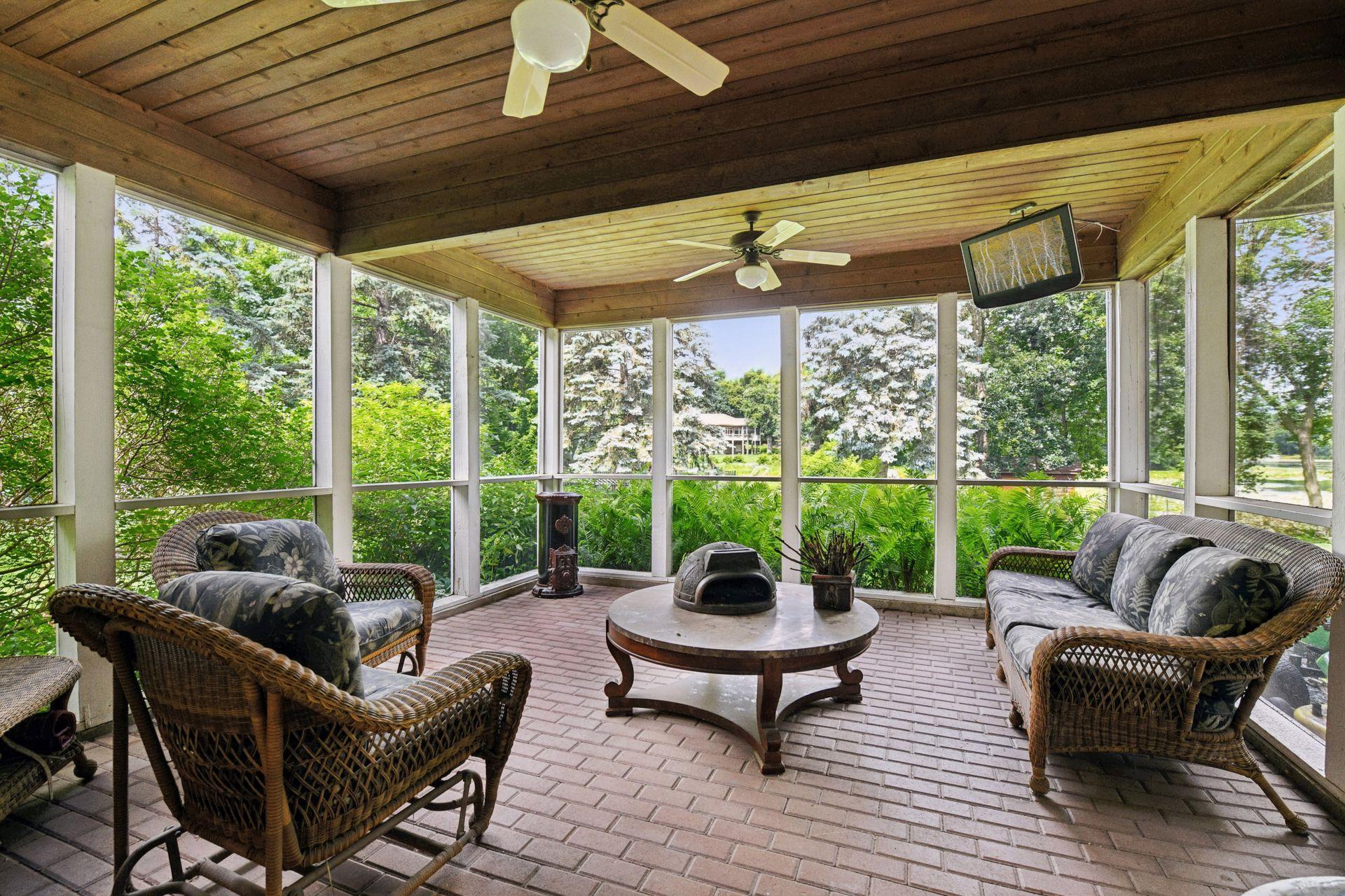 17558 George Moran Drive - Screened porch lower level. Hot tub on lower level too.