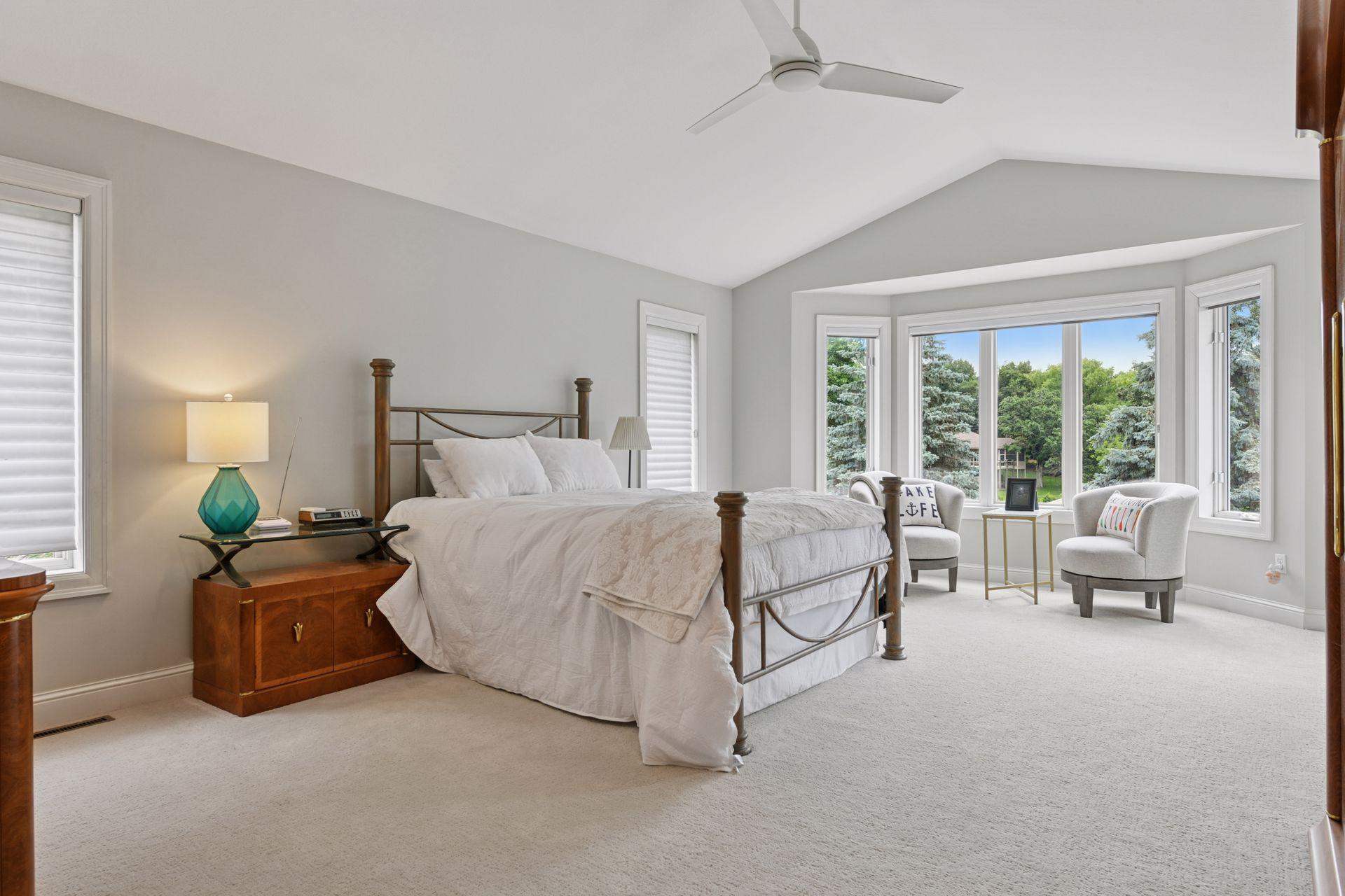 17558 George Moran Drive - Primary bedroom overlooks lake Mitchel. Vaulted ceilings, new carpet throughout the upper level.