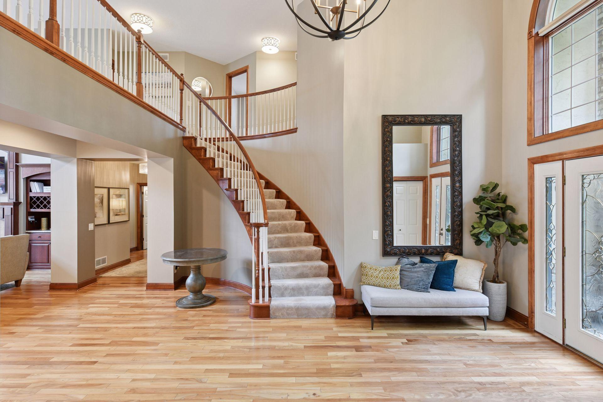 17558 George Moran Drive - Beautiful spriral staircase. Catwalk separate primary suite from the 3 additional upper level bedrooms.