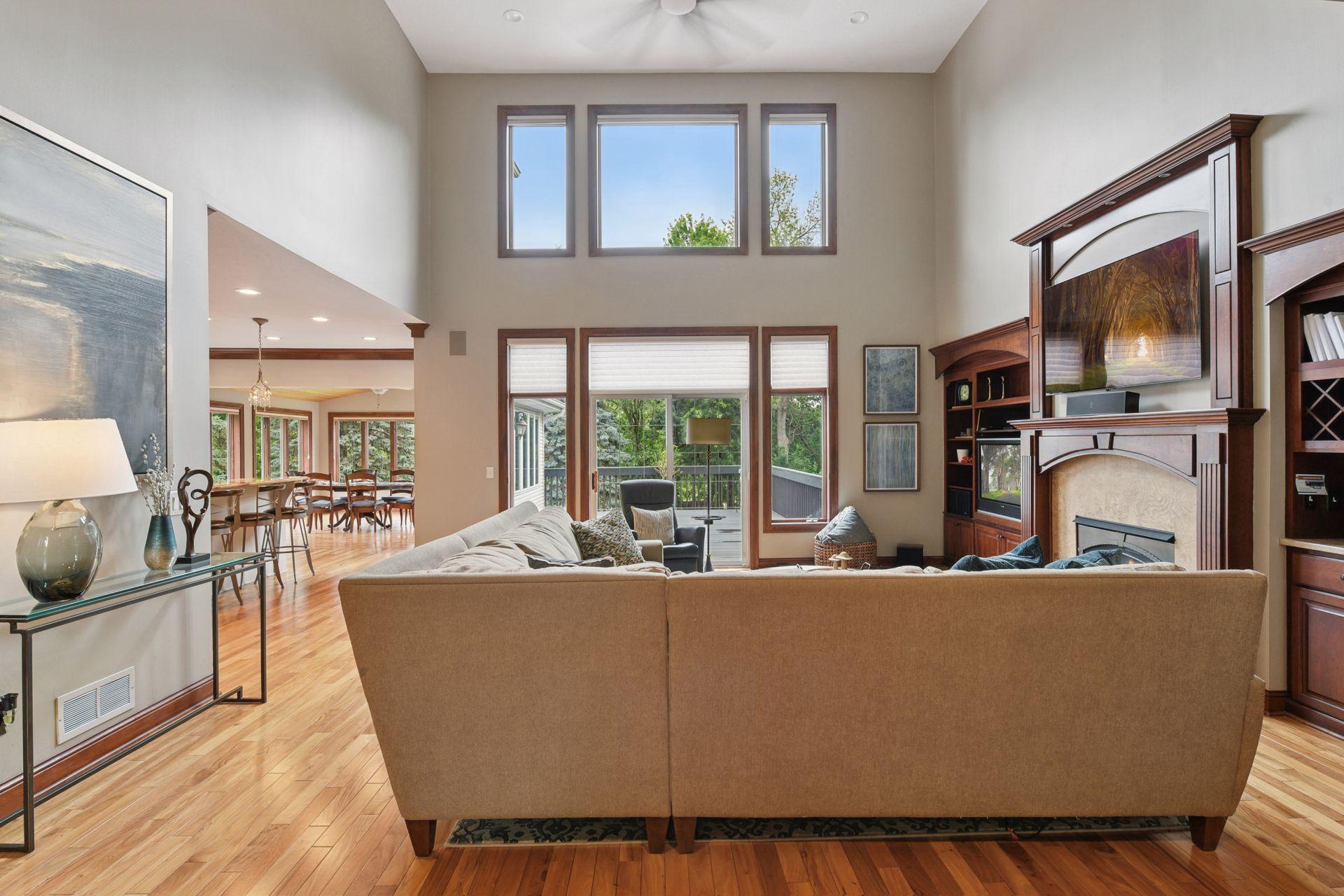 17558 George Moran Drive - Great room over looks the large deck. Over 80 windows capture stunning views and allow natural light into this property.