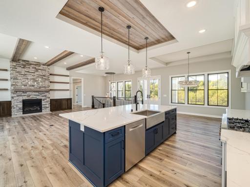 Open floorplan is designed for an overabundance of natural light as you live and entertain from the kitchen area. Fireplace stone can come in a variety of sizes, colors and shapes....when YOU DECIDE TO CUSTOM BUILD YOUR HOME...you pick everything!