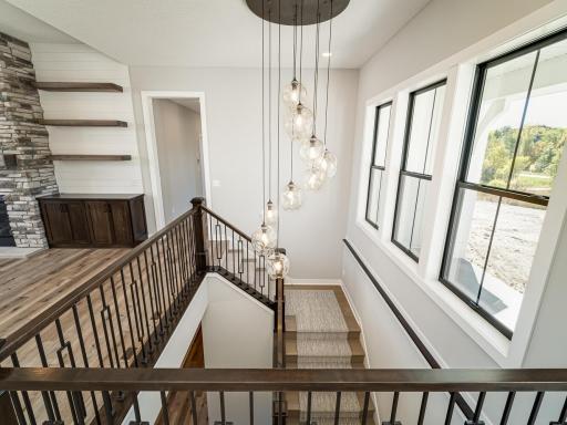 Such a stunning feature of the home; the staircase & lighting!