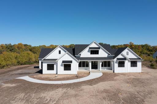 This side load design can also be altered to be a front load garage from the street too. This classic American farmhouse style look remains popular amongst our prospective clientele. If you seek different colors or stone/brick...we can do that too!