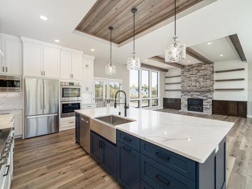 Oversized kitchen sink is situated here in the center island yet the kitchen can be reconfigured/redesigned to also take it OUT of the center island as well...again, that's YOUR CHOICE TO MAKE when you BUILD BRAND NEW!