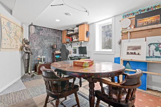 The basement bedroom has a chalk wall as well as a custom plaster wall in the rear.