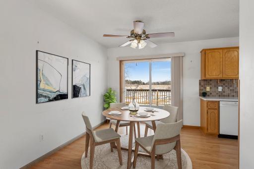 Dining room leads to your deck. Photo was virtually staged .