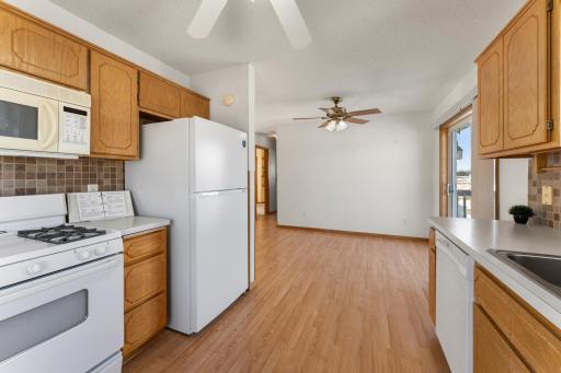 New fridge as well at the home. Image being able to keep an eye on the dining room table guests while in your kitchen.