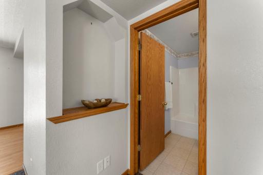 Just before you get into the lower full bathroom, this home comes with a great little display area.
