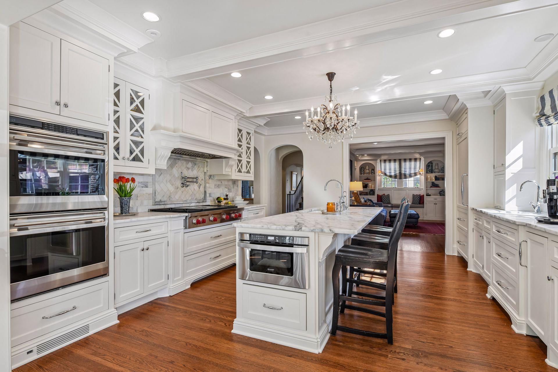 Kitchen with marble tops and wolf range/subzero fridge