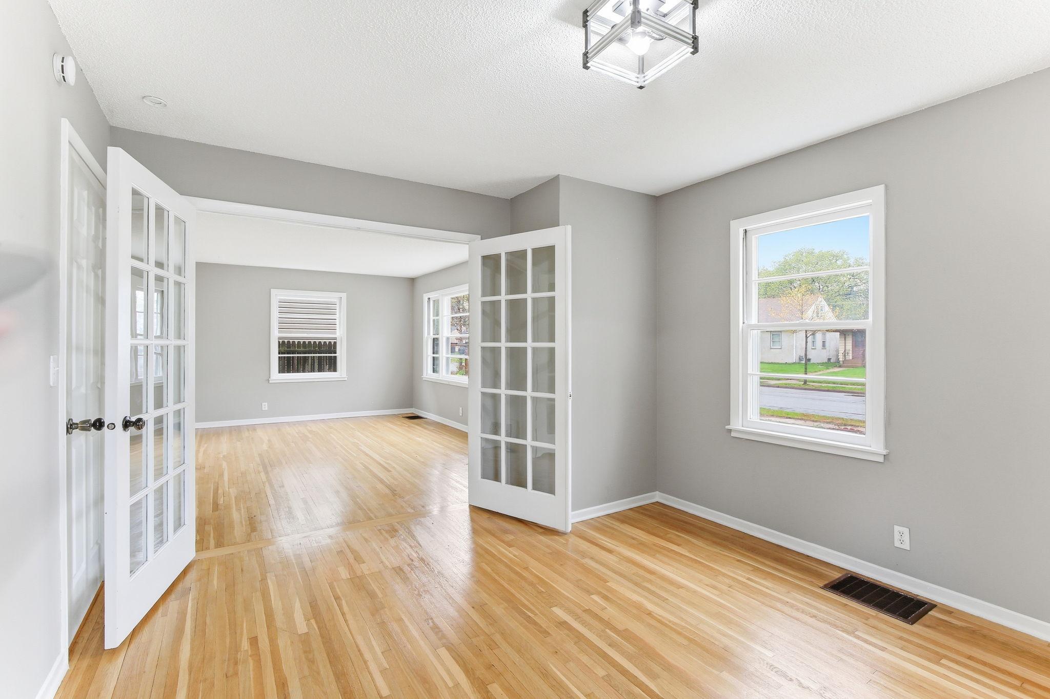 Open Living & Dining with Beautiful Hardwood Floors + French Doors
