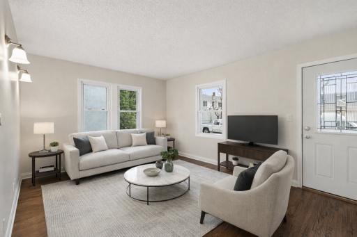 Open & inviting main level living room. *This photo has been virtually staged.