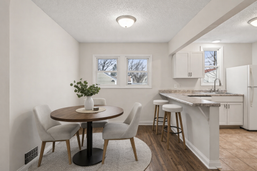Breakfast bar off the kitchen area! *This photo has been virtually staged.