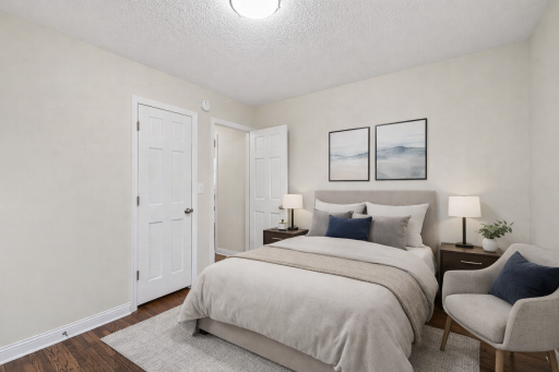 Main level features two bedrooms. *This photo has been virtually staged.